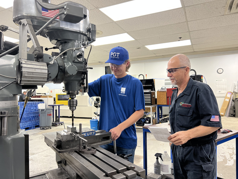 From left to right: Andrew Clark, full-time apprentice at PGT Innovations, with Mike Edmunds, Journeyman Tool and Die maker at PGT Innovations (Photo: Business Wire)