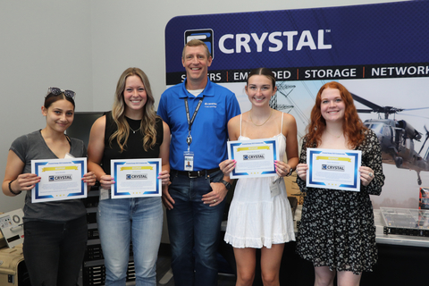 original Crystal Group president, Aaron Maue, presents the internal scholarship recipients with their certificates. (From left to right: Lena Randle, Emily Kono, Aaron Maue, Chloe McDermott and Claire McAllister) (Photo: Business Wire)