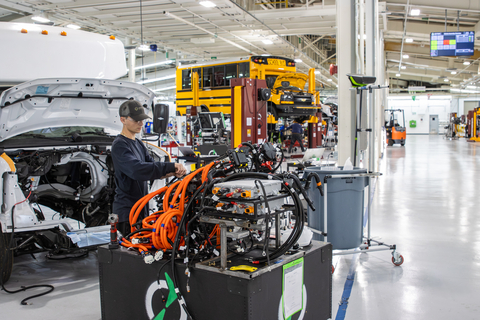 A technician prepares a section of an electric powertrain for installation in a Lightning ZEV4™ shuttle bus in Lightning’s factory in Loveland, Colorado (Photo: Lightning eMotors)