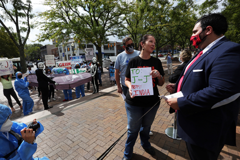 original Advocates from AIDS Healthcare Foundation (AHF), several of its partner organizations, and other concerned citizens held a protest and ‘die in’ in front of the world headquarters of COVID-19 vaccine maker Johnson & Johnson on Wednesday, Sep 22, 2021, in New Brunswick, NJ as part of a “Vaccinate Our World” campaign. Advocates charged J&J with refusing to expand global production of its vaccine by withholding patents and manufacturing know-how from other producers and for exporting vaccines produced in South Africa to Europe while 94% of people in Africa remain unvaccinated due to severe vaccine shortages. (Bruce Gilbert, AP Images, for AHF)