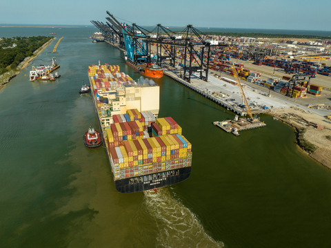 thumbnail A container vessel passes in front of the construction of Bayport Terminal's wharf 6 with its three new STS cranes (black) offloaded on the dock. Wharf 6 is expected to be completed in October. (Photo: Business Wire)