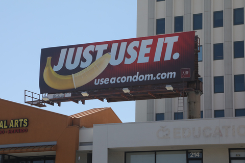 AIDS Healthcare Foundation (AHF) continues to promote condom use and free HIV testing with its latest outdoor advertising campaigns, but the billboards featuring a condom-covered banana with the “Just Use It” slogan and the “useacondom.com” URL only will appear in Los Angeles after several national out-of-home advertising companies refused the artwork. (Photo: Business Wire)
