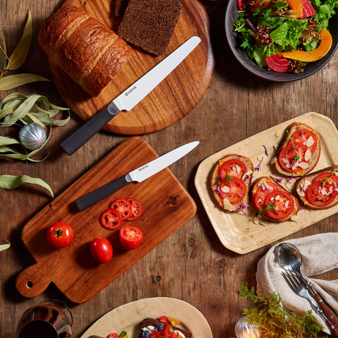 Kyocera INNOVATIONwhite ceramic micro-serrated bread knife and ultra-sharp tomato knife will help make holiday meals a snap this season. (Photo: Business Wire)