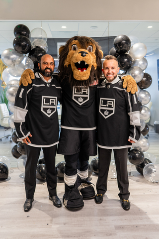 CD LAW partners and co-founders Vineet Dubey and Miguel Custodio are joined by LA Kings mascot Bailey to celebrate CD LAW's new marketing partnership with the LA Kings. (Photo: Business Wire)