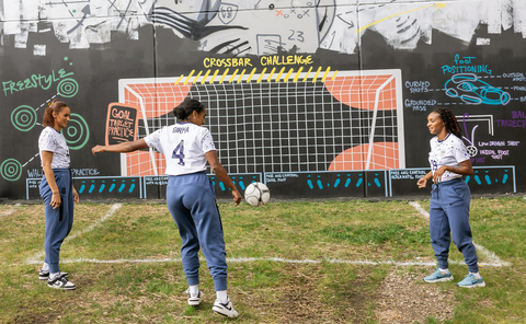 U.S. Women's National Team players , Lynn Williams, Naomi Girma, and Crystal Dunn (left to right) use the coaching mural for practice drills. (Photo: Business Wire)