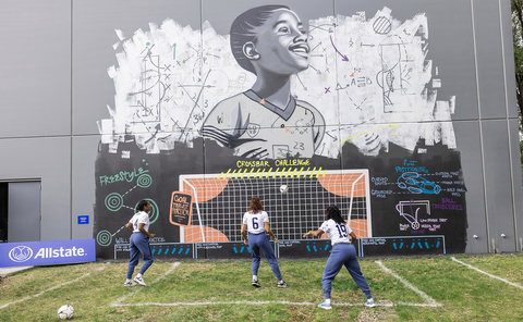 U.S. Women's National Team players Naomi Girma, Lynn Williams and Crystal Dunn (left to right) use the coaching mural to practice the 