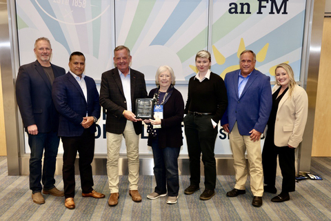 thumbnail Sheila Sheridan presents the IFMA Awards of Excellence plaque to ESFM President David Hogland, along with other ESFM leaders and associates, during IFMA's 2023 World Workplace in Denver. (Photo: Business Wire)