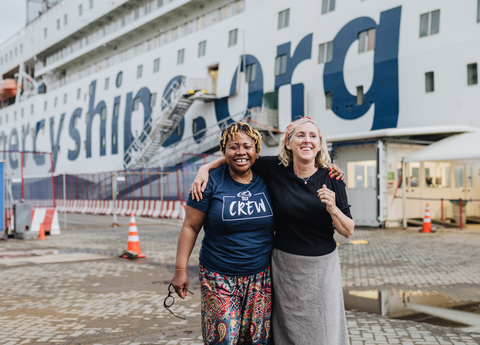 Catherine Conteh reunited with the nurse, Aly Hogarth-Hall, who helped save her life 30 years ago. The pair have been reunited and are volunteering together on board Mercy Ships' newest hospital ship the Global Mercy, in Catherine's home country of Sierra Leone. (Photo: Business Wire)