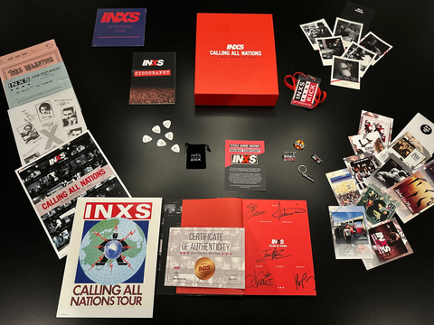 Calling All Nations – A Fan History Of INXS is available now exclusively via INXS.com. The release is offered in three formats, including the standard First Edition hardback book, as well as a limited-edition Deluxe boxset, and an extremely limited-edition Super Deluxe box, which is hand-signed by the members of INXS - Garry, Andrew, Jon, Tim, and Kirk. The Deluxe edition contains the First Edition Hardback book in a presentation box that holds new and reproduced archival items, including a 7-inch vinyl interview disc, fan club letters, album postcards, polaroid photos, badges, a keyring, a complete gigography, and more. Additionally, the extremely limited-edition Super Deluxe boxset includes everything in the Deluxe box as well as a numbered certificate, a Calling All Nations t-shirt, two numbered Art Prints, and an embroidered logo patch made from an actual piece of the band’s dressing room curtain, used during their tours! (Photo: Business Wire)