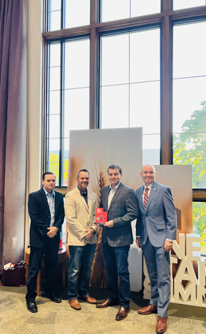 Left to right: Ben Hart (UIPA), Benn Buys (UIPA), James Barlow (BZI), and Governor Spencer Cox at the One Utah Summit. Barlow received the "Rural Investor Award" from the Utah Inland Port Authority on behalf of BZI. (Photo: Business Wire)