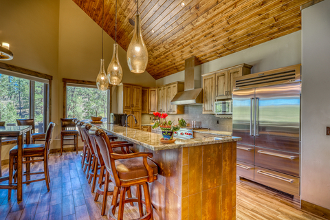 Robust appliances, handsome wood finishes, and a backdrop of inspiring views make the main residence's kitchen perfect for preparing a mountainside feast while welcoming family and friends. COLuxuryAuction.com. (Photo: Business Wire)