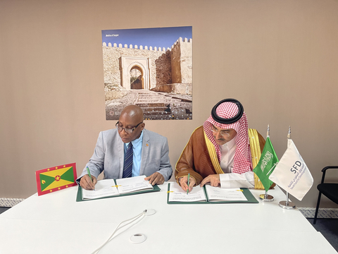 original SFD CEO, H.E. Sultan Al-Marshad, and Minister of Finance of Grenada, Hon. Dennis Cornwall, signed the first development loan agreement between SFD and Grenada (Photo: AETOSWire)