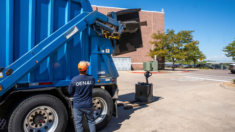 Denali employee Russell Rowland unloads a bin containing food waste at a Denver-area Walmart store. Denali carries out similar collections at 4,700 Walmarts in the U.S. (Photo: Business Wire)