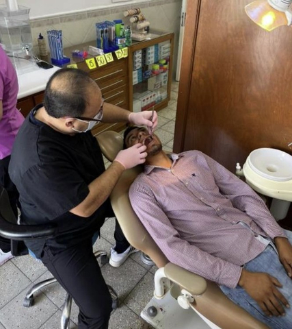 A dentist performs a dental examination on a NatureSweet employee in Tuxcacuesco, Mexico. (Courtesy of NatureSweet.)