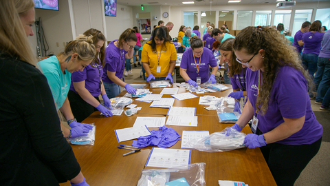 In partnership with MedShare, athenahealth volunteers work to assemble some of the 2,624 clean birthing kits, designed to provide safe and hygienic births for people around the world who lack quality access to childbirth health services. (Photo: Business Wire)