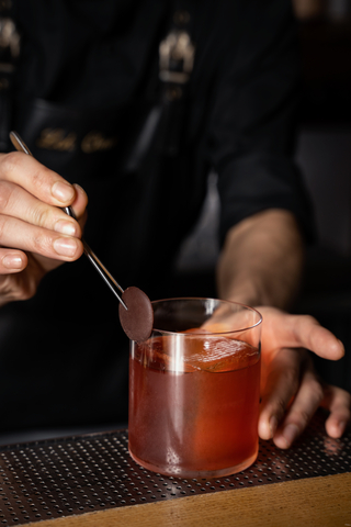 Inspired by Mexico’s drinking dens, COA serves unique cocktails like their Mole Negroni (Photo: Business Wire)
