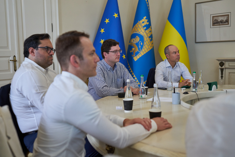 From front to back: Chicago Atlantic Trident Partners Dmitriy Lampert and Konstantinos Nakis alongside Chicago Atlantic Co-Founders Andreas Bodmeier and John Mazarakis, reviewing plans for affordable housing on a working visit to Ukraine. (Photo: Business Wire)