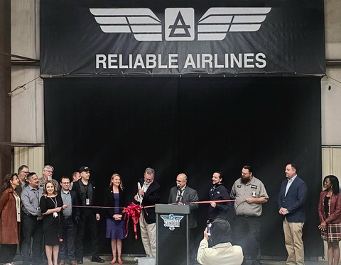 Congresswoman Melanie Stansbury, Reliable Airlines President Tom Klassen, Director Richard McCurley and Manny Manriquez from the City of Albuquerque Aviation along with Reliable Airlines team members and other guests participate in the airline’s ribbon cutting ceremony (Photo: Business Wire)