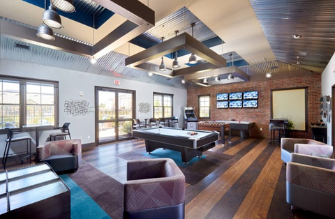 original The on-base apartments at Reece Crossings include a total quality-of-life-package and attract single soldiers with their robust amenities, short-term lease options, and affordable rent which includes all utilities and cable. (Photo: Business Wire)