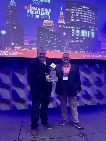 From left: Ryan Biddix, continuous improvement manager at Lenoir; and Mark Parsons, operations manager, Lenoir, receiving the award at the Annual AME Conference in Cleveland, Ohio, yesterday. (Photo: Business Wire)