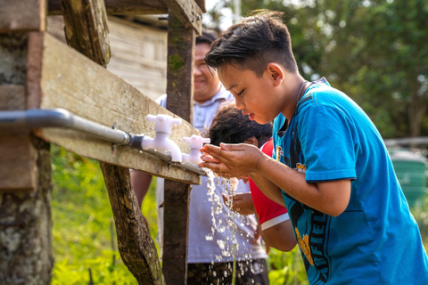 A young Malaysian boy drinks clean water from a water filter installed by Beyond2020, the UAE-driven humanitarian initiative (Photo: AETOSWire)