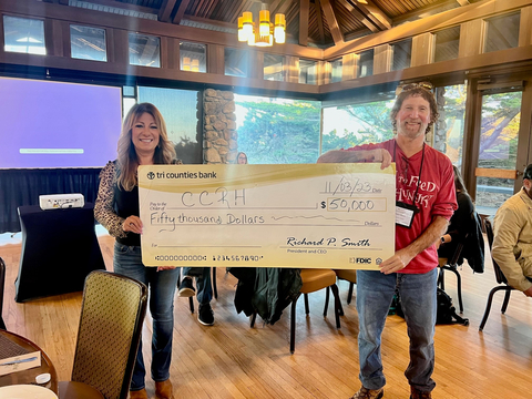 Tri Counties Bank presents a $50,000 check to the California Coalition for Rural Housing (CCRH), awarded through the Federal Home Loan Bank of San Francisco's AHEAD economic development grant program. Pictured in this image from left to right: Rose Pereirra, Community Development Officer at Tri Counties Bank; and Rob Wiener, Executive Director at CCRH. (Photo: Business Wire)