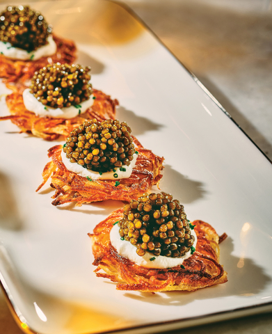 Potato Latkes with Caviar at the Champagne & Caviar Bar (Photo: Business Wire)