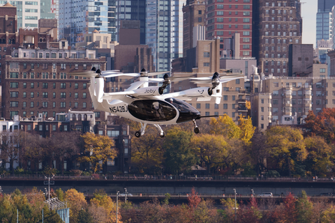 Joby’s electric air taxi in the skies above New York City, piloted by James “Buddy” Denham. Joby Aviation Image