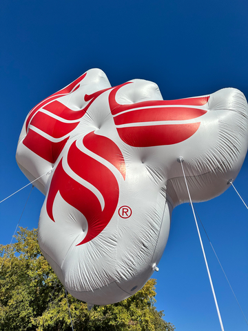 A University of Phoenix balloon flies overhead during the Phoenix Veterans Day Parade, an annual event for which University of Phoenix is a Medal of Honor sponsor. The parade was held on November 11, 2023, in Phoenix, AZ. (Photo: Business Wire)