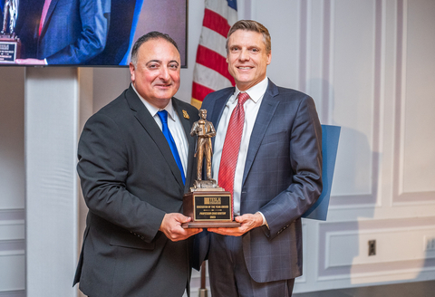 Chad Bouton (right) is handed the 2023 Tesla Innovator of the Year Award from Marc Alessi, executive director of the Tesla Science Center at Wardenclyffe during its Tesla Legacy Gala. (Credit: High Tide Media LLC)