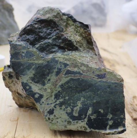 Figure 4 – Epidote, potassium-feldspar-altered, and arsenopyrite mineralized mafic volcanic sample. (Photo: Business Wire)