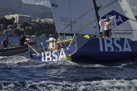 original Transat Jacques Vabre: Alberto Bona and Pablo Santurde del Arco on the Class40 IBSA after crossing the finish line in Fort-de-France, Martinique (©IBSA | Beppe Raso)