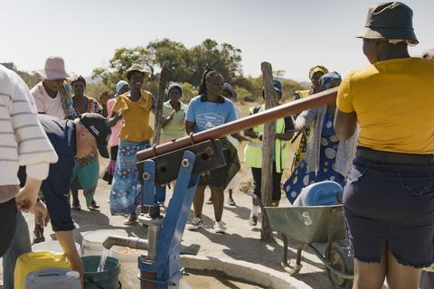 A community in Africa celebrates a new handpump, created with support from Kalahari Resorts and Conventions. Access to clean water significantly reduces the risk of waterborne diseases, decreases the likelihood of malnutrition, and promotes proper hygiene within communities. (Photo: Business Wire)