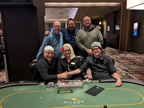 Five of the Texas Hold’em poker players from Rivers Casino Pittsburgh on Nov. 28 who will share a $905,622.13 jackpot. Front row (left to right): Brent Enos, Evelyn Gussenhoffen (dealer) and Scott Thompson. Back row (left to right): Frederick Humelsine, Kevin Graham and Daniel Stefancin. (Photo: Business Wire)