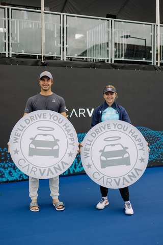 original Carvana presented 2023 PPA Tour Point Winners Ben Johns and Anna Leigh Waters with an oversized Carvana coin representing their vehicle prize. (Photo: Business Wire)