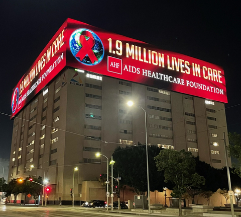 On World AIDS Day, AHF, the world’s largest HIV/AIDS health care organization, has taken over the largest digital sign on the West Coast. AHF’s message – “1.9 Million Lives in Care” – will show every couple minutes all day Friday on three sides of the building located on Broadway off the I-10 in downtown Los Angeles. Freeway commuters have a clear view of the building’s display. (Photo: Business Wire)