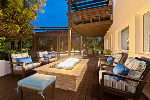 Outdoor living areas include a spacious, 2-level deck with firepit lounge and summer kitchen, surrounded by mature landscaping for added privacy. The deck includes a private boardwalk to the beach that features a cabana with seating area, fish-cleaning station, and outdoor shower. Learn more at OceanfrontLuxuryAuction.com. (Photo: Business Wire)