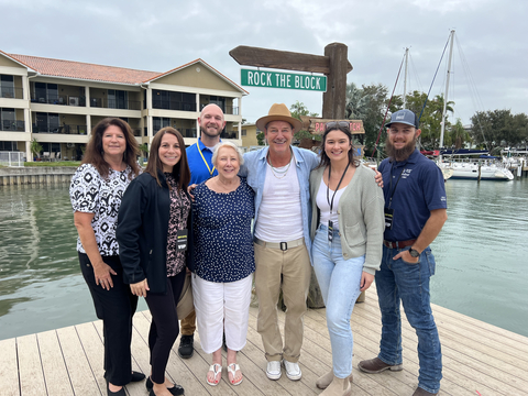 From left to right: First row - Stephanie Cz, PGT Innovations; Suzanne Nault, PGT Innovations; Ty Pennington, host of Rock the Block; Brianna Bibb, PGT Innovations; and Erik Matson, PGT Innovations. Second row - Denine Harper, PGT Innovations; and Noah Copenhaver, PGT Innovations in Treasure Island, Florida (Photo: Business Wire)