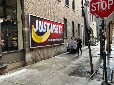 original AHF's “Just Use It” billboard campaign now is running in three new cities – Chicago, New York City, and Miami – after several national out-of-home advertising companies refused the artwork back in August. The billboards feature a condom-covered banana with the “Just Use It” slogan and the “useacondom.com URL." One seen here is adjacent to Brett's Kitchen on the corner of Superior St. and Franklin St. in Chicago, IL 60654 (Photo: Business Wire)
