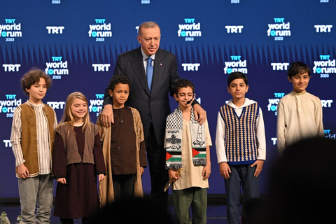original President of Turkey Recep Tayyip Erdogan with children at the TRT World Forum 2023 (Photo: Business Wire)