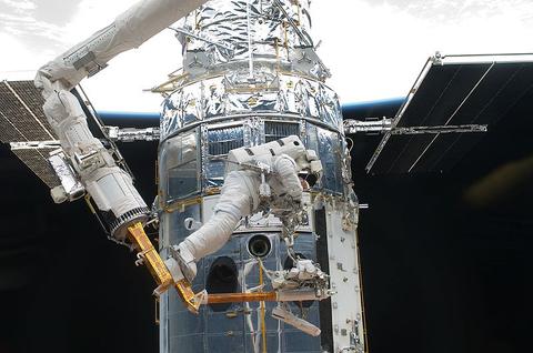 Feustel works on the Hubble Space Telescope; photo credit: NASA