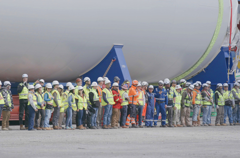 Local workers gather in New Bedford for the arrival of the first wind turbine components at the Marine Commerce Terminal in May 2023. Photo Credit: Worldview Films
