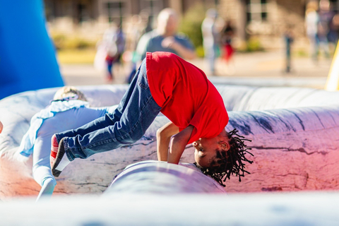 thumbnail Bounce houses at CPM’s kid-friendly events are always a hit with the youngest residents. (Photo: Business Wire)