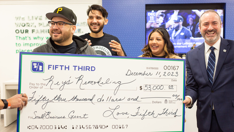 Rey’s Remodeling owners Erick and David Rey are surprised with a small business grant from Fifth Third. Fifth Third personal banker Yajayra Guzman and Indiana Regional President Mike Ash are featured at right. (Photo: Business Wire)