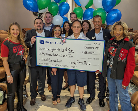 Delight Nails & Spa owner Oanhna Thi Chau accepts a $53,000 small business grant from the “prize patrol” as part of the Love, Fifth Third campaign. (Photo: Business Wire)