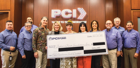 original Arturo and Susan Echarte (fourth and fifth left), Co-Founders of Postal Center International (PCI), present a symbolic check to Lindsay Giambattista Cox (center), Founder and Creative Director; and Linda Giambattista, Co-Founder and Executive Director at Taylor’s Closet Foundation, Inc. at PCI’s corporate headquarters in Weston, Florida, on Wednesday, December 6, 2023. Looking on (from left) are Henry Herrera, PCI’s Vice President of Major Accounts; Dennis R. Garcia, PCI’s Executive Vice President & CFO; Chris Diaz, Chief Operations Officer; Francine Salomons, PCI’s Director of Human Resources; Ismael Diaz, PCI’s President & CEO; Brian McGrath, PCI’s Chief Information Officer; and Tom Roberts, Senior VP of Client Experience at PCI. The check was part of a donation from the PCI Powerhouse Fund to several South Florida-based children's welfare organizations. (Photo: Business Wire)