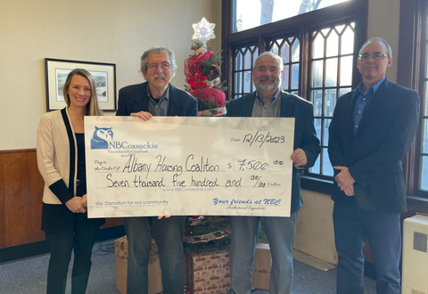 Pictured here from left to right is NBC Chief Financial Officer Caitlin McCrea, Albany Housing Coalition Inc. Executive Director Joseph Sluszka, NBC Community Banking Officer Mark Maraglio, and NBC Chief Operations Officer Donald Gardner. (Photo: Business Wire)