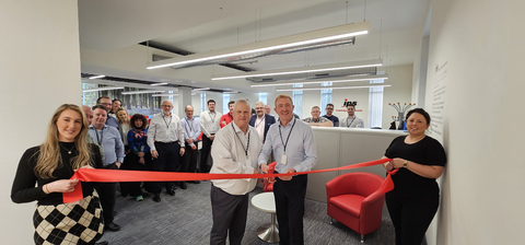 IPS UK Open a New Office in Manchester. Glen Slaymaker - IPS UK Director & Dennis Wareing - Director of Risk & Compliance cut the ribbon to open the new office. (Photo: Business Wire)