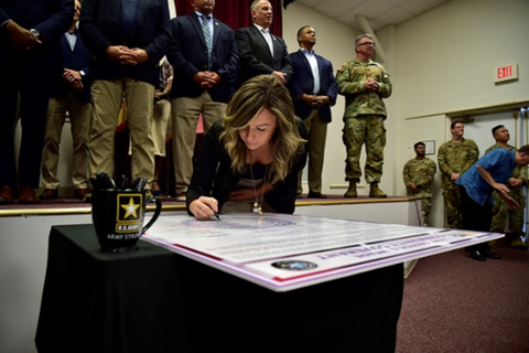 thumbnail Brittney Dabney, Corvias Operations Director at Fort Meade participates in the 2023 Community Covenant Signing and Great American Defense Community Recognition event. (Photo: Business Wire)