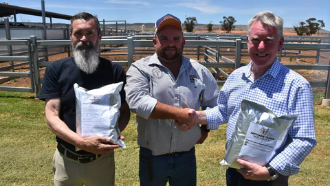 CH4 Global CEO Steve Meller, left, delivers the first commercial shipment of the company's Methane Tamer (TM) cattle feed supplement to CirPro Australia CEO Reg Smyth, right, and Heath Tiller, center, owner of the HB Rural feedlot in Warnertown, South Australia. The supplement is formulated using Asparagopsis seaweed, which can reduce enteric methane emissions from cattle by up to 90%. Photo by Alisha Fogden.